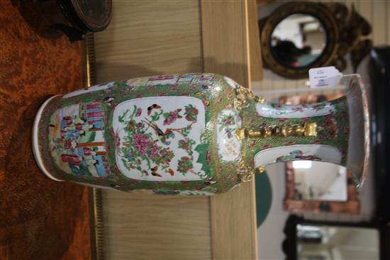A large Chinese Canton-decorated famille rose baluster vase, 19th century, height 63cm, wood stand